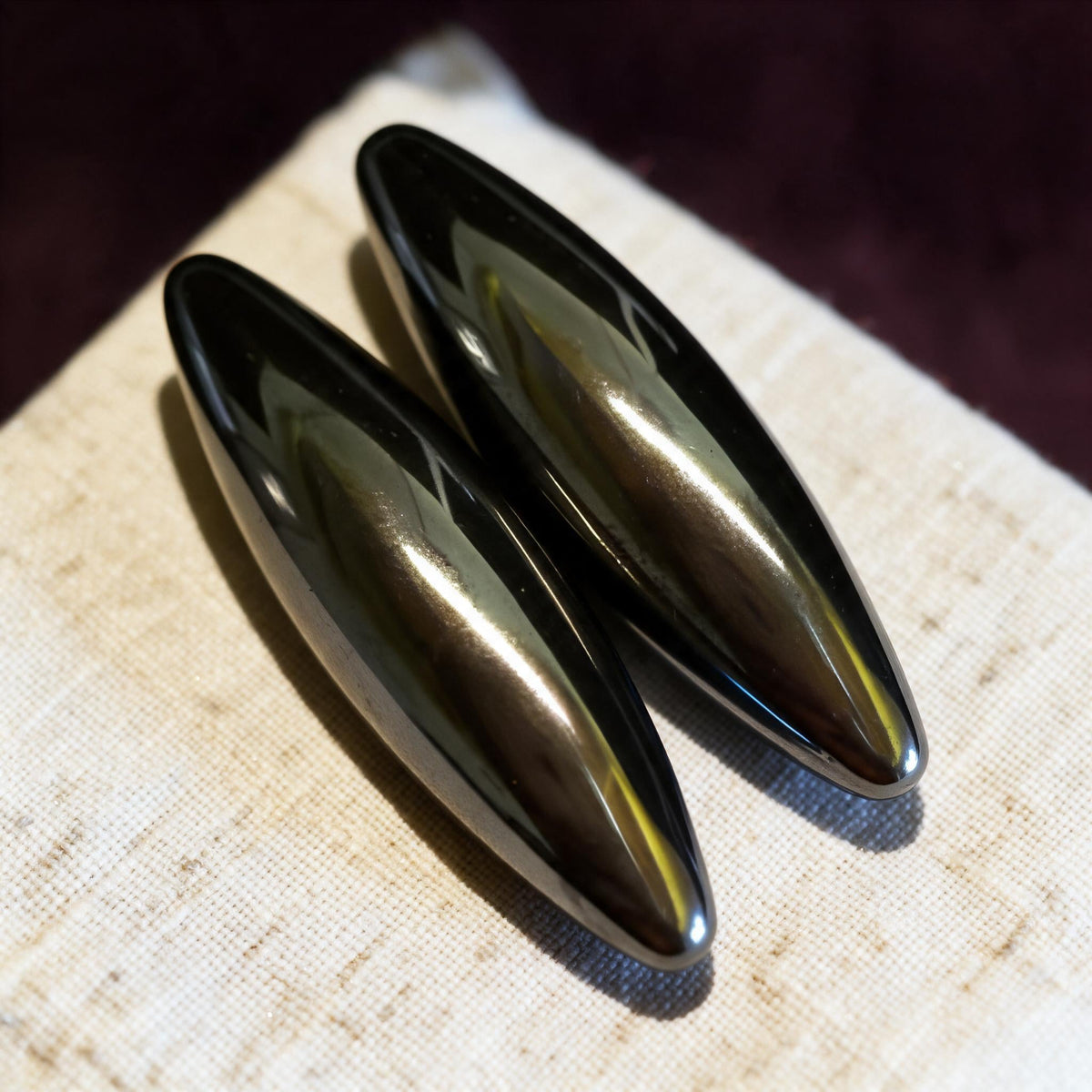 pair of polished hematite ovals
